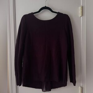 Purple knit sweater with sheer detailing in the back